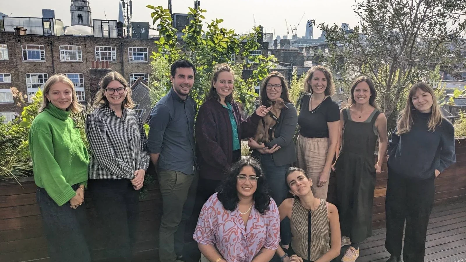 Team members of Opportunity Green on an outside balcony
