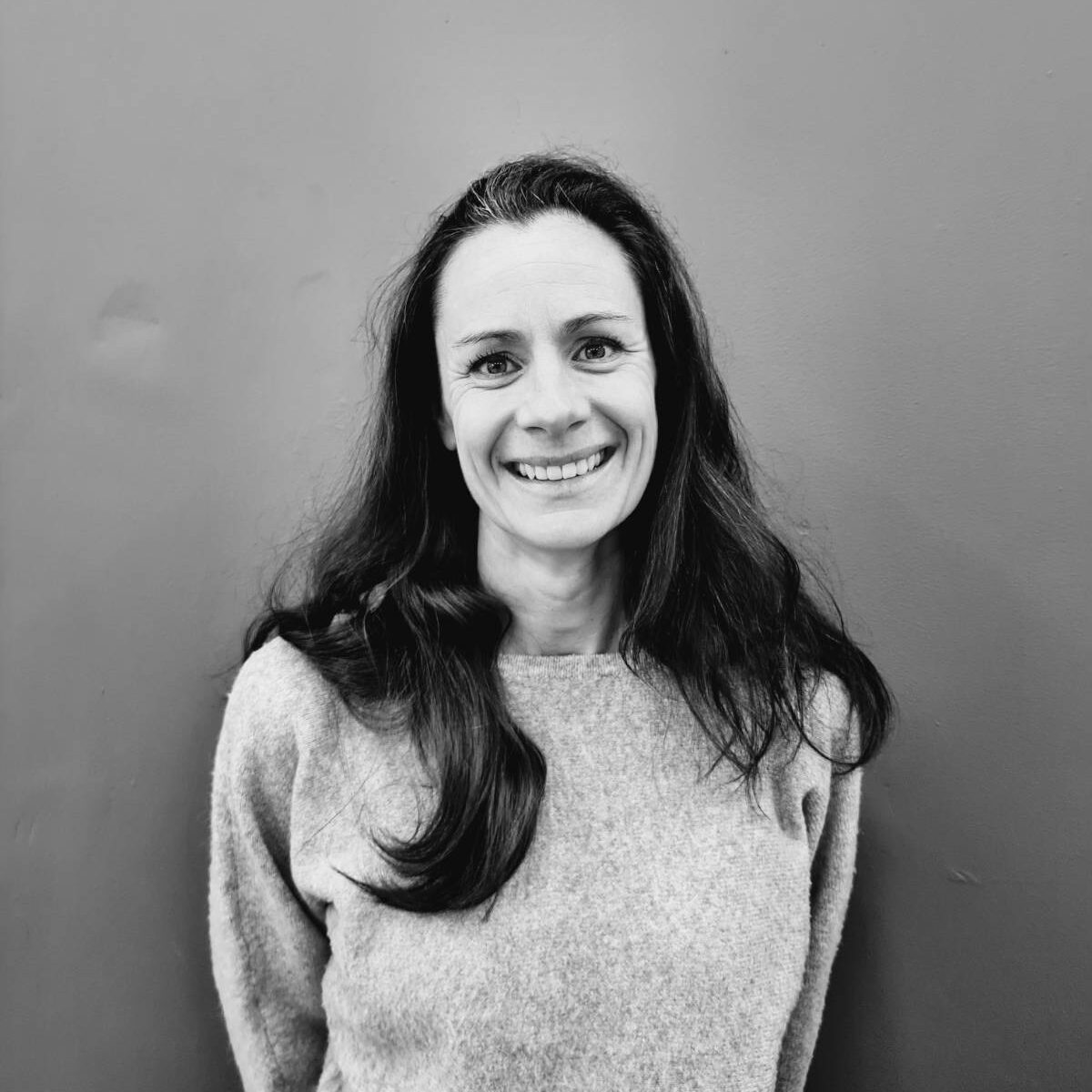 Black and white image of Gill Johnson, Chief Operating Officer at Opportunity Green.