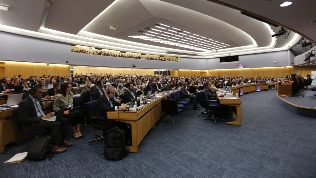 journalist photo of IMO meeting hall full with ongoing discussions from the side