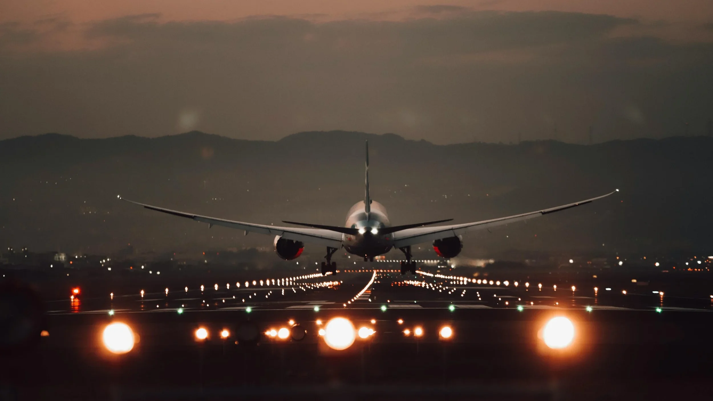 jet plane taking off from the back lights on the tracks jet plane taking off from the back lights on the tracks