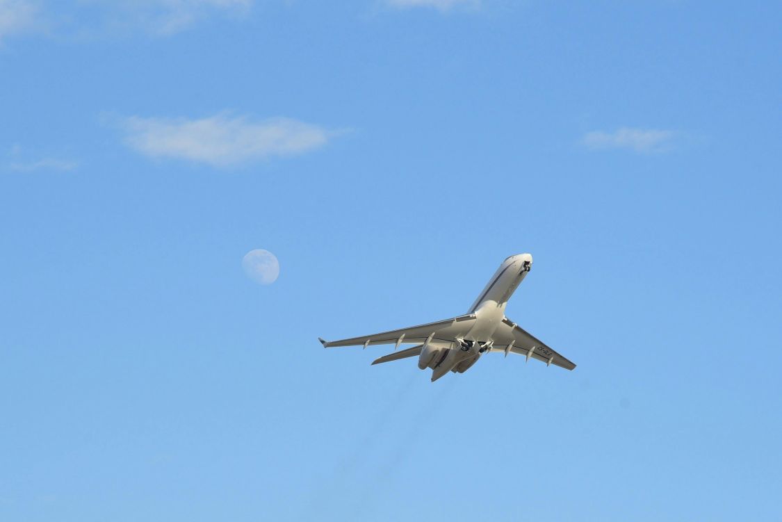 A commercial aeroplane jetting across the sky