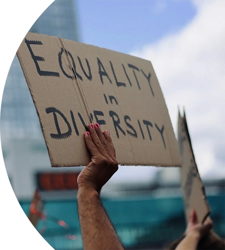 Equality in diversity cardboard sign being held up