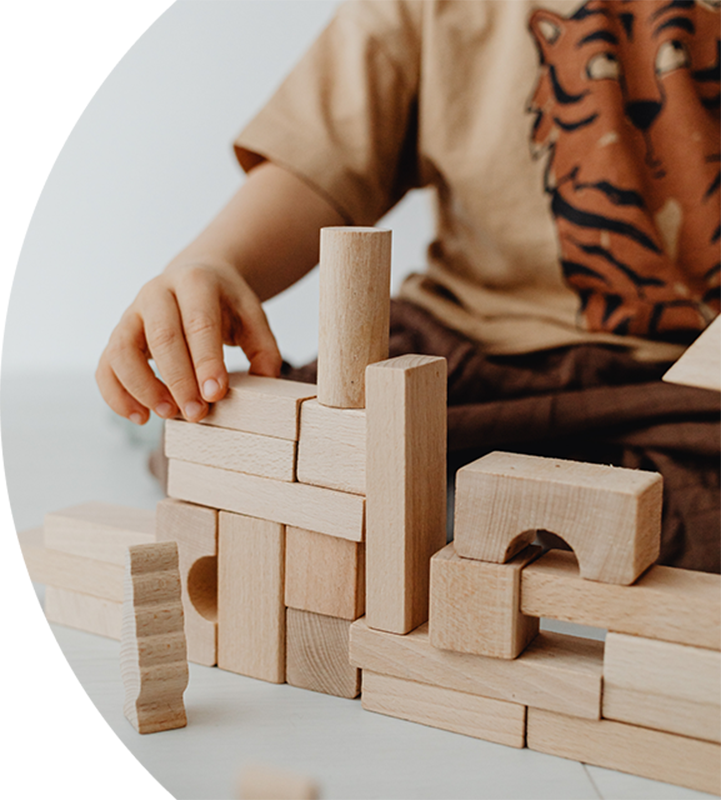 Child playing with wooden bricks