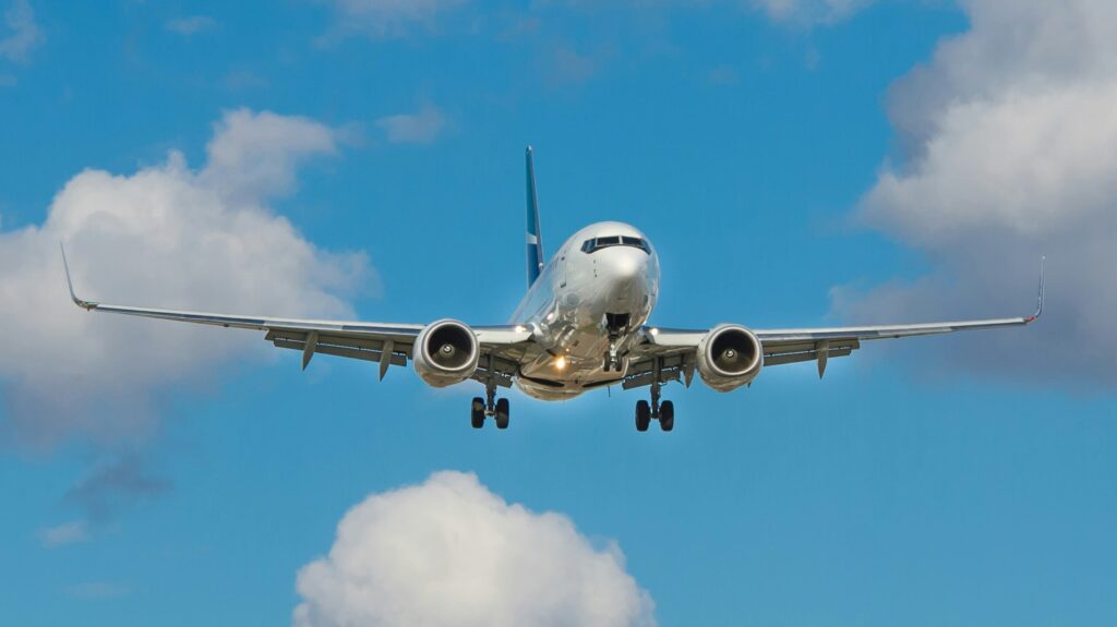 Ground view of an airplane coming into land